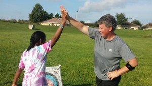 Carey Miller, Sundance Manager and Archery Sponsor, wins competition and gives high five to runner-up Indaya Byer who enjoyed competing with Miller.